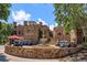 Stone building with fountain and golf carts parked in front of building at 16825 Bolsena Dr, Montverde, FL 34756