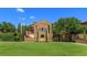 Grand stone residence showcasing manicured lawn and exquisite landscaping, exuding elegance and charm at 16825 Bolsena Dr, Montverde, FL 34756