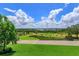 Scenic golf course view from an elevated position with lush greenery and picturesque landscaping at 16825 Bolsena Dr, Montverde, FL 34756