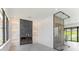 Bright living area with electric fireplace, marble wall, and wine cellar with backyard view at 16825 Bolsena Dr, Montverde, FL 34756