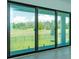 Large sliding glass patio door providing seamless indoor/outdoor living and views of the backyard at 16825 Bolsena Dr, Montverde, FL 34756