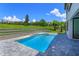 Inviting backyard featuring a pool, spa, and landscaped yard at 16825 Bolsena Dr, Montverde, FL 34756