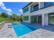 Resort-style pool and patio with a modern home exterior at 16825 Bolsena Dr, Montverde, FL 34756