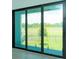 Large sliding glass doors offering natural light and scenic backyard views at 16825 Bolsena Dr, Montverde, FL 34756