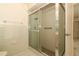 Bathroom featuring a glass enclosed shower with tile walls and floor at 406 Red Coat Ln, Orlando, FL 32825