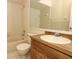 Bathroom featuring a wooden vanity, ceramic tile and bath tub at 406 Red Coat Ln, Orlando, FL 32825