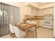 Cozy kitchen area enhanced by a charming dining set and offering a delightful culinary space at 406 Red Coat Ln, Orlando, FL 32825