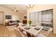 Comfortable living and dining area with a neutral color palette and contemporary furnishings, perfect for relaxation and entertaining at 406 Red Coat Ln, Orlando, FL 32825