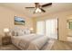 Inviting main bedroom with neutral walls, plush carpeting, and a private entry to the bathroom at 406 Red Coat Ln, Orlando, FL 32825