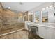 Stylish bathroom featuring a spacious walk-in shower, double sinks, and modern fixtures at 8778 Peachtree Park Ct, Windermere, FL 34786