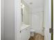 Clean bathroom with white cabinets, a shower, and a toilet at 8778 Peachtree Park Ct, Windermere, FL 34786
