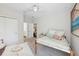 Bedroom with a comfortable bed, white walls, and soft carpet at 8778 Peachtree Park Ct, Windermere, FL 34786