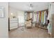 Well-organized walk-in closet with ample storage, clothing racks, shelving, and a comfortable sitting area at 8778 Peachtree Park Ct, Windermere, FL 34786