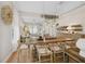 Dining room showing hardwood floors, a rustic dining table, and elegant decor at 8778 Peachtree Park Ct, Windermere, FL 34786