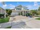Charming two-story home with a beautifully landscaped yard and a three-car garage at 8778 Peachtree Park Ct, Windermere, FL 34786