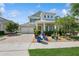 Inviting two-story home with a well-manicured lawn and attractive landscaping at 8778 Peachtree Park Ct, Windermere, FL 34786