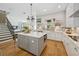 Stunning kitchen featuring an island with seating, stainless appliances, and modern finishes at 8778 Peachtree Park Ct, Windermere, FL 34786