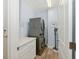 Clean laundry room featuring a stacked washer and dryer, ample counter space, and neutral wall paint at 8778 Peachtree Park Ct, Windermere, FL 34786