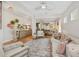 Spacious living room showcasing hardwood floors, modern decor, and an open layout at 8778 Peachtree Park Ct, Windermere, FL 34786