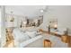 Bright, open-concept living room with modern decor, wood floors, and a staircase at 8778 Peachtree Park Ct, Windermere, FL 34786