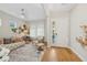 Cozy living room with hardwood floors, stylish furniture, and abundant natural light at 8778 Peachtree Park Ct, Windermere, FL 34786