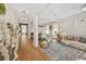 Elegant living room featuring hardwood floors, neutral decor, and an open floor plan at 8778 Peachtree Park Ct, Windermere, FL 34786