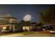 Nighttime street view of suburban homes with a dazzling fireworks display illuminating the sky at 8778 Peachtree Park Ct, Windermere, FL 34786