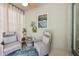 Bright sunroom featuring comfortable seating, an area rug, and a view of the outdoors at 8778 Peachtree Park Ct, Windermere, FL 34786