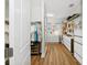 Spacious walk-in closet with custom shelving, wood floors and a large mirror, providing ample storage space at 8778 Peachtree Park Ct, Windermere, FL 34786