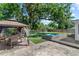 Beautiful backyard with a paver patio, gazebo and hot tub surrounded by lush landscaping and mature trees at 919 Boardman St, Orlando, FL 32804