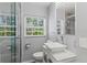 Contemporary bathroom with marble countertop, square sink, and glass enclosed shower at 919 Boardman St, Orlando, FL 32804