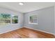 Bright bedroom with hardwood floors and natural light from large windows at 919 Boardman St, Orlando, FL 32804