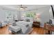 Bright bedroom with a large bed, wood floors, and neutral decor at 919 Boardman St, Orlando, FL 32804