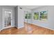 Bedroom featuring wood floors, mirrored closet doors, and natural light at 919 Boardman St, Orlando, FL 32804