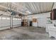 The garage has ample space, a utility sink, washer, dryer hookups, and storage shelves at 919 Boardman St, Orlando, FL 32804
