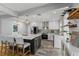 Modern kitchen boasts a large island, stainless appliances, and elegant pendant lighting, creating a chef's dream space at 919 Boardman St, Orlando, FL 32804