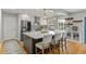 Modern kitchen boasts a large island, stainless appliances, and elegant pendant lighting, creating a chef's dream space at 919 Boardman St, Orlando, FL 32804