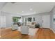 Bright living room featuring hardwood floors, neutral decor, and large windows, creating a welcoming atmosphere at 919 Boardman St, Orlando, FL 32804