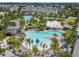 Aerial view showcasing a community pool area with tropical palm trees, lounge chairs, and resort-style amenities at 9421 Dugard Ct, Orlando, FL 32827