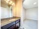 Spacious bedroom features neutral carpeting, arched doorway, large mirror, and abundant natural light at 9421 Dugard Ct, Orlando, FL 32827