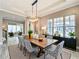 Elegant dining room with a large table, stylish chairs, and ample natural light at 9421 Dugard Ct, Orlando, FL 32827