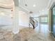 Spacious foyer with views to living spaces, stairs, and modern finishes, creating an open and inviting atmosphere at 9421 Dugard Ct, Orlando, FL 32827