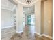 Elegant foyer featuring tile flooring, archways, and views into other rooms, offering a welcoming entry at 9421 Dugard Ct, Orlando, FL 32827