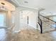 Inviting foyer with arched doorways, tile flooring, and a staircase leading to the upper level at 9421 Dugard Ct, Orlando, FL 32827