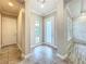Entryway with tile flooring, decorative wall details, and natural light, providing a warm welcome at 9421 Dugard Ct, Orlando, FL 32827