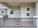 Covered front porch featuring detailed railings and multiple windows, offering curb appeal and natural light at 9421 Dugard Ct, Orlando, FL 32827