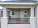 Spacious front porch with modern railings and columns, creating an inviting outdoor space at 9421 Dugard Ct, Orlando, FL 32827