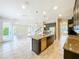 Modern kitchen with granite countertops, stainless steel appliances, and a kitchen island perfect for entertaining at 9421 Dugard Ct, Orlando, FL 32827