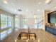 Kitchen island with stainless steel sink, granite countertop, and views of the living area at 9421 Dugard Ct, Orlando, FL 32827