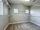 Bright, spacious walk-in closet with installed shelving and two windows offering ample natural light at 9421 Dugard Ct, Orlando, FL 32827